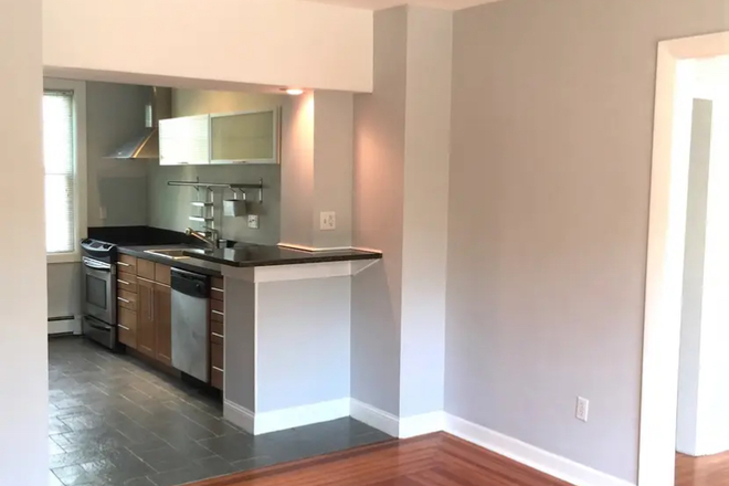 Dining room looking into kitchen - "Posh Wayland Sq. renovated unit with Jacuzzi tub, view of park, off-street parking" Condo