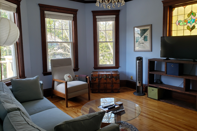 Living room (Note: TV is no longer there.) - Roommate wanted for my bright, quiet 2BR; near Design Sch.; washer/dryer, parking; 3rd fl. walk-up House