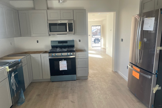 kitchen (gas range)  looking into living room/entrance - Be first in line for renovated 3 bed 2 bath home close to CU Denver/Anschutz