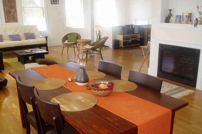 Dining Room with Fireplace - Furnished Penthouse Loft Condo (1400 sq ft) in Cambridge
