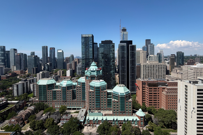 View from Living Room / Balcony - Spacious 1+Den Penthouse (680 SF) with High Ceilings — Downtown Toronto