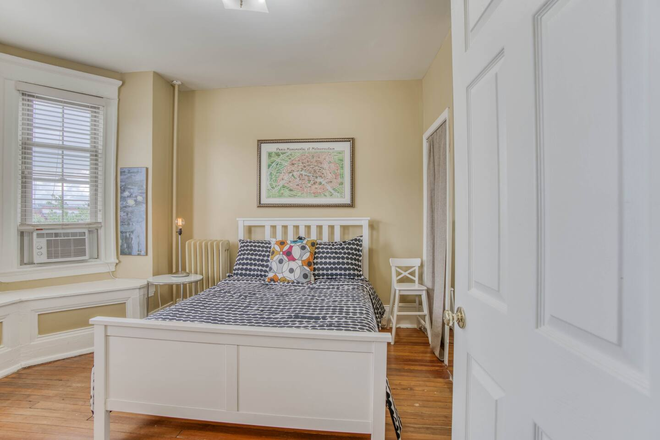 Front bedroom - Bright and Spacious FULLY FURNISHED 2BD Apt in Charles Village