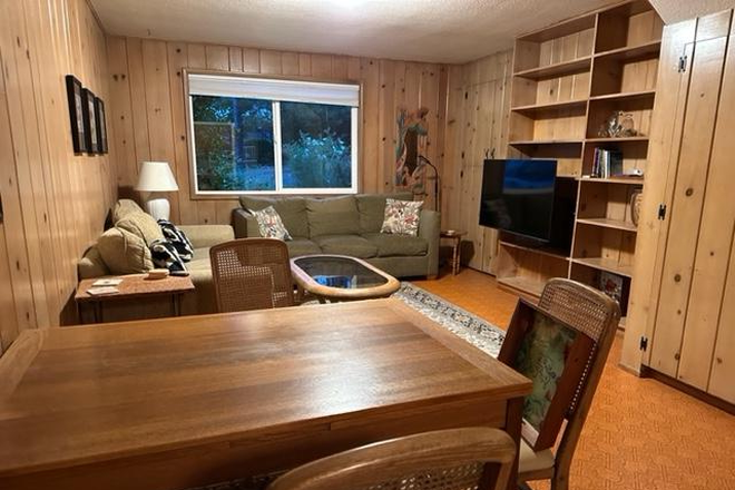 Dining area, living room, and TV - Central, spacious, gardens. Beautiful neighborhood. Untilities WiFi included.