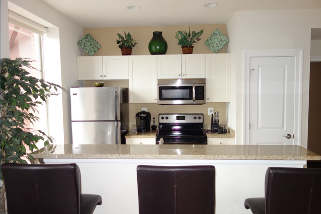 Kitchen with island - 1334 Walnut Street Apartments