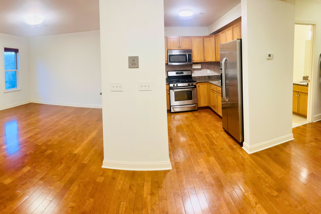 Panaromic view of the first level, living area, kitchen, dining area and half bath - Webster Willow Condo