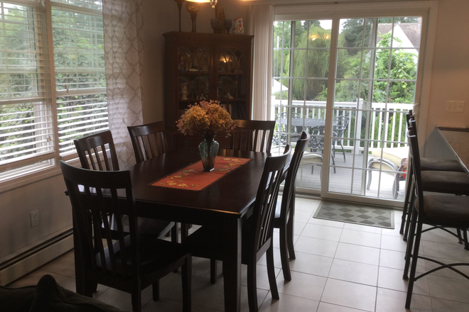 Open kitchen/Dining with sliding doors to deck. - 45 Allagash Trail Narragansett, RI 02882 House