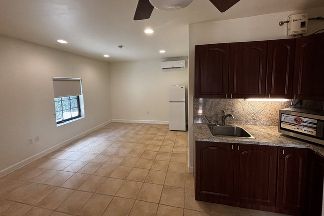 Kitchen area - Studio located in quiet Coral Gables area, 1 block to trolley stop, short ride  to Metro Station House