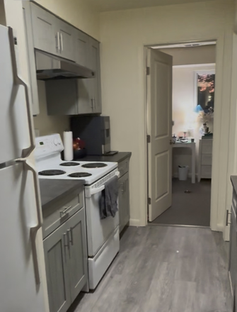 Partial views of kitchen and 1 bedroom - 3 BR/ 2 BA Norwich Gardens Apartment - Available June