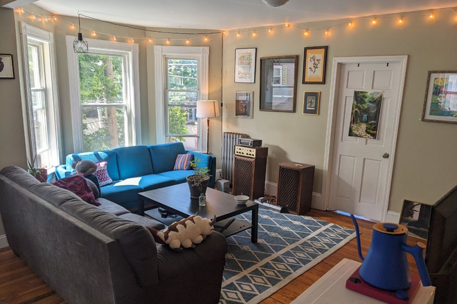 Wide shot of living room - 2 open rooms in a large & bright 4 bed/1 bath near campus, $1140/mo each