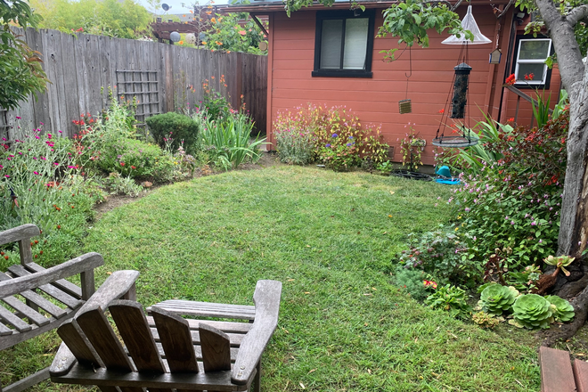 Yard & cottage view from back fence. - Utilities included COTTAGE (2 bedrm/1bath) with lovely back yard close to BART and buses.