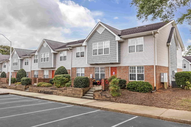 Parking lot and outside view out townhouse-apartment - University Suites