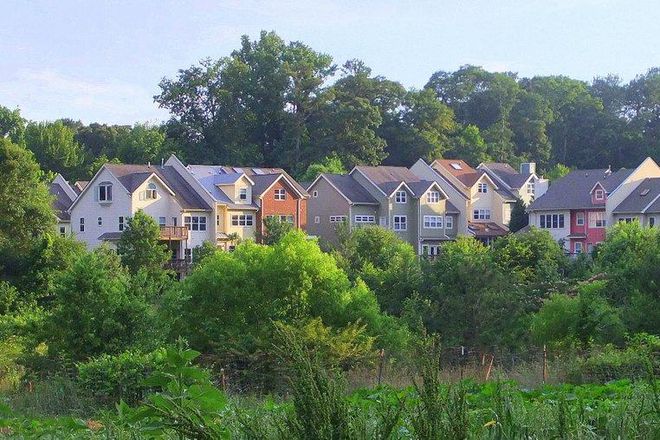 View of townhomes from across the pond - East Lake Commons - Townhouse Overlooking Pond/Forest/Farm
