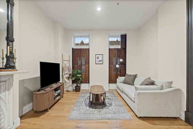 Living Room + Shutter windows - Fully Furnished Brownstone in Safe & Welcoming Neighborhood Apartments