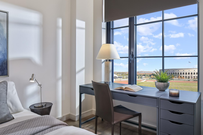Bedroom, view is same even though this image is AI generated - 100 South Campus Drive Apartments