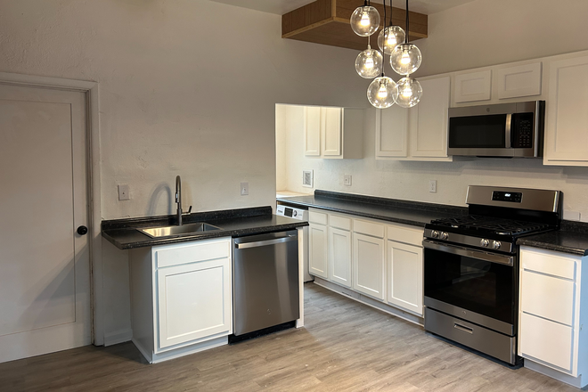 Spacious kitchen with high end stainless appliances and LED Lighting - Private 1 Bedroom in Beautiful Victorian Home w/ front porch + Pet OK