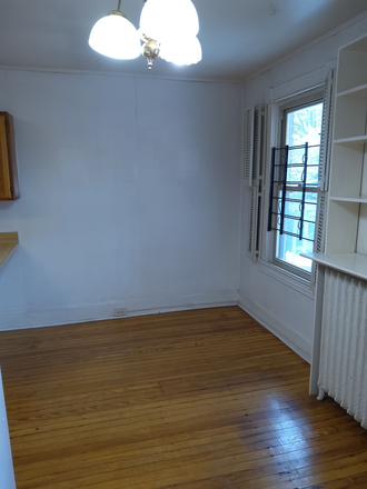 Den or Dining Area - 1-bedroom apartment with den and private deck close to Homewood Campus