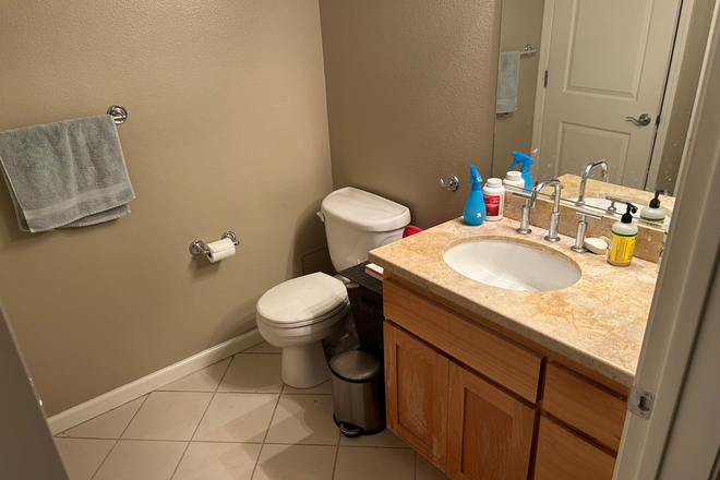 Upstairs Bathroom; Laundry across the wall - Fully Furnished Spacious Loft Style Corner Condominium Filled with Natural Light