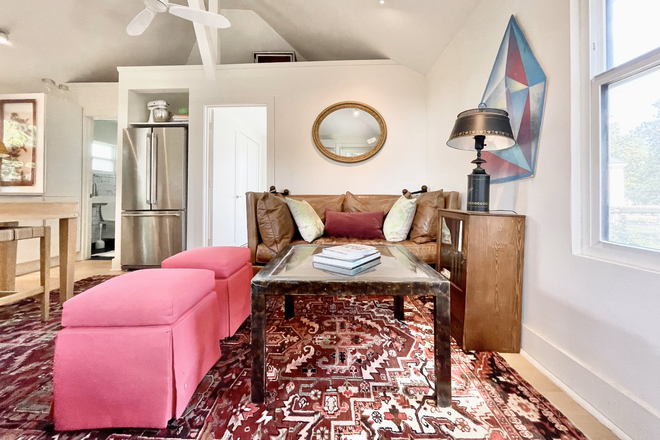 Main living area - Sunny, Fully Furnished 1-Bedroom Garage Apartment