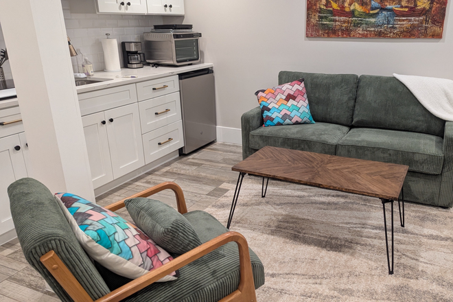 Living room and kichenette - Fully renovated, furnished English basement very close to campus