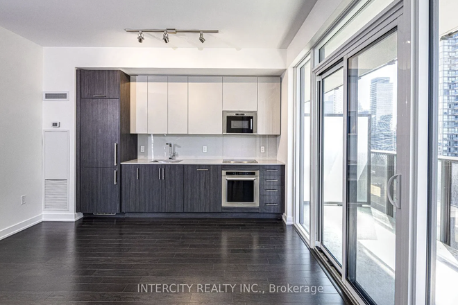 Kitchen - 1 Bedroom in High-Rise Condo with Large Windows!