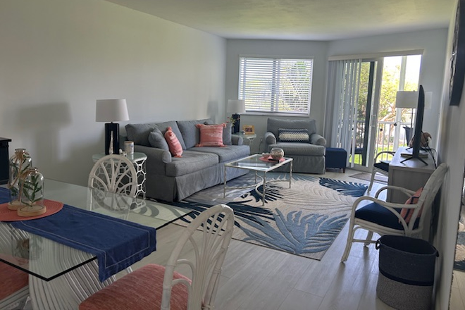 livingroom - doors to screened patio - Condo Fully furnished, Jun-Dec rental Excell condition, 15 min. FAU, across from beach
