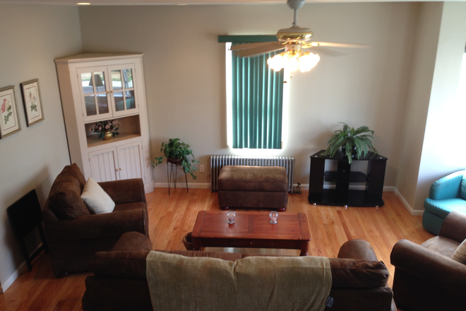 Living room - Large Room for rent in beautiful house close to campus