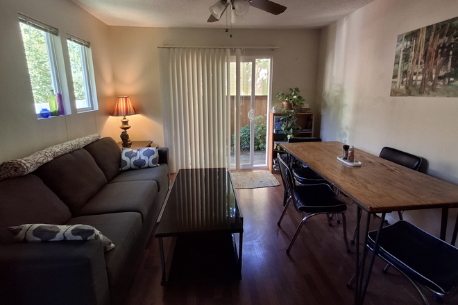 living room and door to patio - Alpine Village Apartments