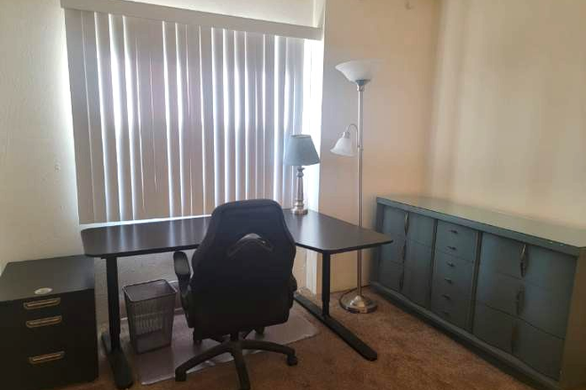 upstairs bedroom fully furnished with desk and queen bed - 2 Bedroom Condo in Main Gate Campus Walk Condo - PRIME CAMPUS LOCATION!