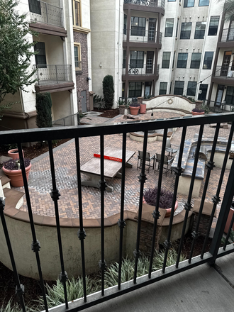Balcony view to the patio - Highlander at North Campus Student Housing Apartments