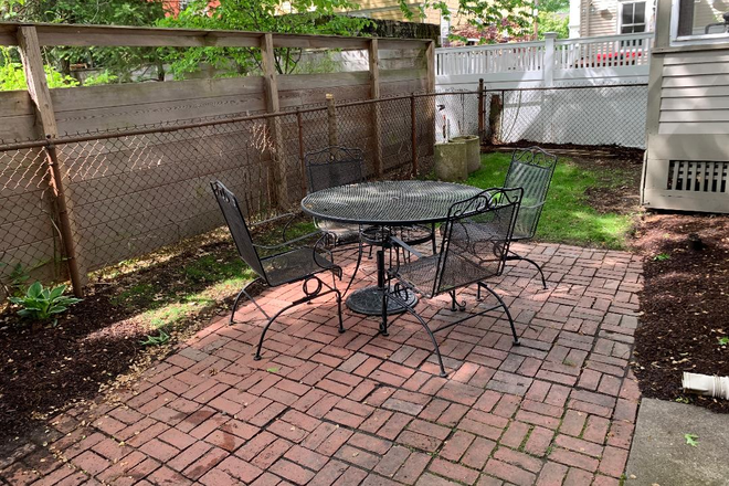 Back yard - Sunny, spacious 4BR/1BA is av. September 1s., walk to Harvard T. Apartments