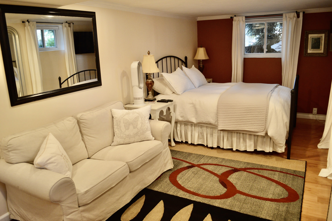 Large bedroom and closet - Walk to Campus. Large garden level, 1-bedroom, furnished apartment with open plan kitchen living.