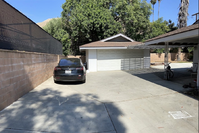 Backyard/parking lot - Room available very close to UCR campus House