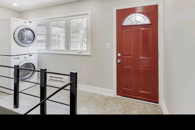 Shared laundry, exterior entrance/exit - Bright and comfy 1 bedroom lower suite with shared backyard, St. Clair West House