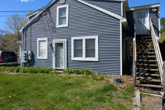 Exterior view. This listing is for the top-floor unit. - Belchertown Cozy Unit