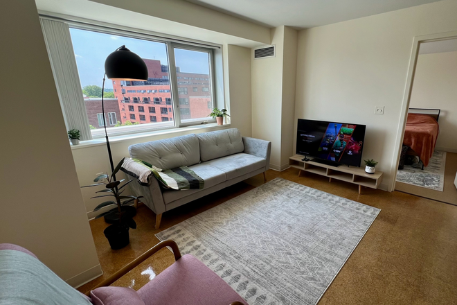 Living room 3 - One Western Ave -- furnished bedroom & private bathroom in 2BR/2BA Apartments