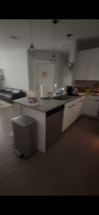 island, sink, and dishwasher - The Indy Apartments