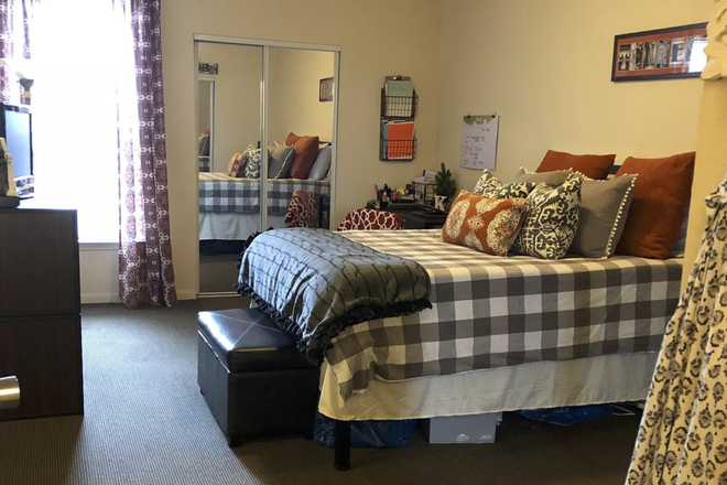 Example layout of bedroom; comes with sliding closet door, bed, desk, and dresser. - The Heights of Knoxville Apartments