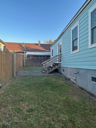 Fenced in side yard - The Little Blue Cottage House