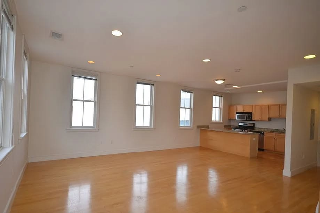 Downstairs, kitchen/dining area - 2 bedroom, 2.5 bath, corner apartment, lease re-let through Aug 2026 in Kendall Square