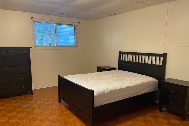 Bedroom furnished with double bed and dresser - 1 Furnished Bedroom in All Female Home