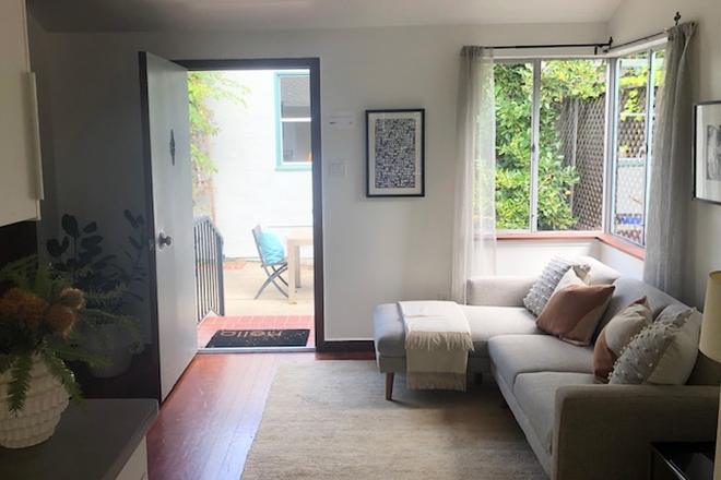 Living room - Peaceful backyard cottage with big windows and hard wood floors