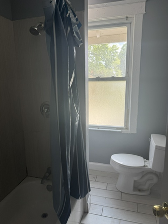 Bathroom 1 of 2 - 5 bedroom, 2 bath, yard  several rooms available. Townhome
