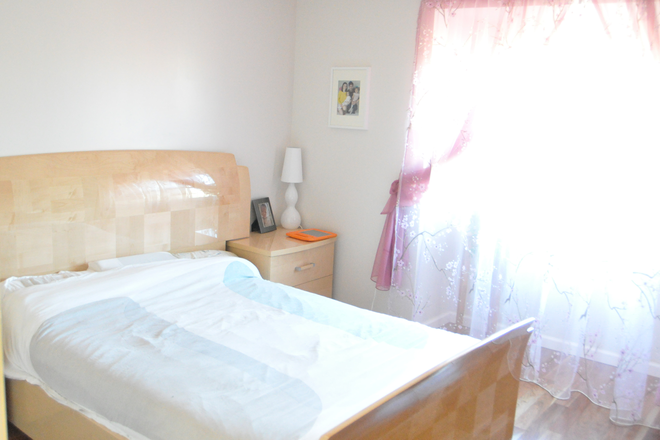 Bedroom with the bed frame - Spacious and Sunny, Private Bedroom in a Beautiful Duplex, NEU campus/ 1 year plus lease