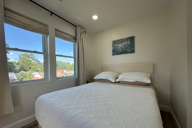 Master Bedroom - Newly Renovated Furnished 2BR Suite Near UMD – Utilities Included Apartments