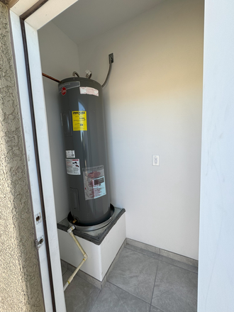 Mechanical room with electric water heater - 328 E Lester Street House