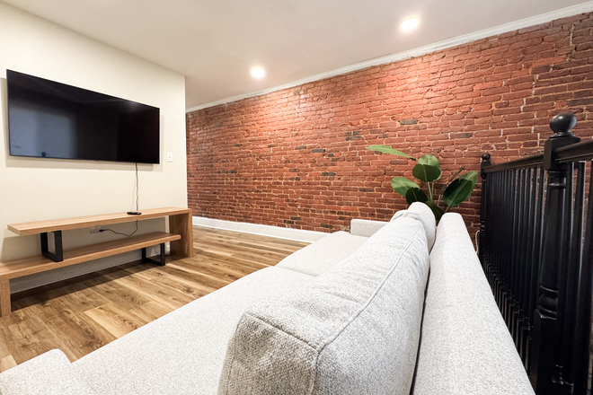 Loft Style Living room - Fully Furnished 2BR/1.5BA Apartment in Reservoir Hill – Newly Updated & Close to Johns Hopkins!