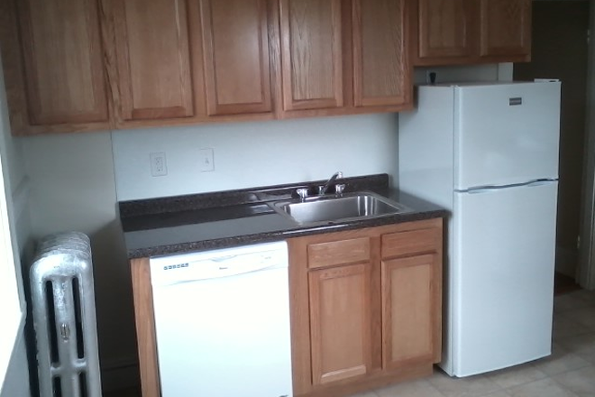 Visit hubrealtyproperties.com - Large one bedroom with front view and deck, in Brighton Apartments