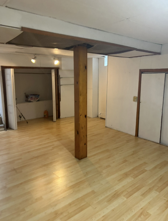 This is the large basement room that is available for new tenant's use. - SEEKING ROOM MATE FOR 2 BR APARTMENT (1ST FL) IN 2-FAMILY HOUSE.