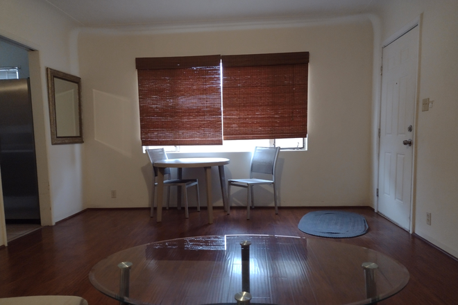 Living room table, chairs and window - 3 Bedroom 2 Bathroom Close to U of Az Campus Duplex