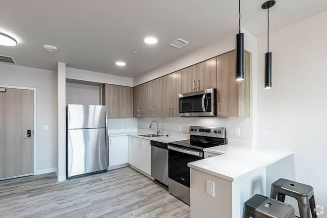 Living room and kitchen - Fieldstone Umass Amherst, heart of the campus close to two dining halls